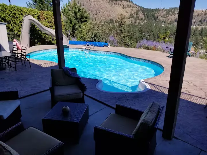 Covered outdoor seating beside the swimming pool